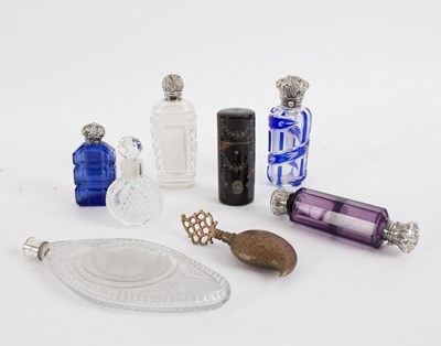 Lot 71 - A group of five various silver mounted scent...