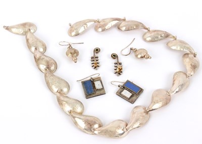 Lot 1 - A silver necklace of modern design, JT, London...