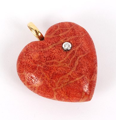 Lot 9 - A coral heart-shaped pendant set with a...