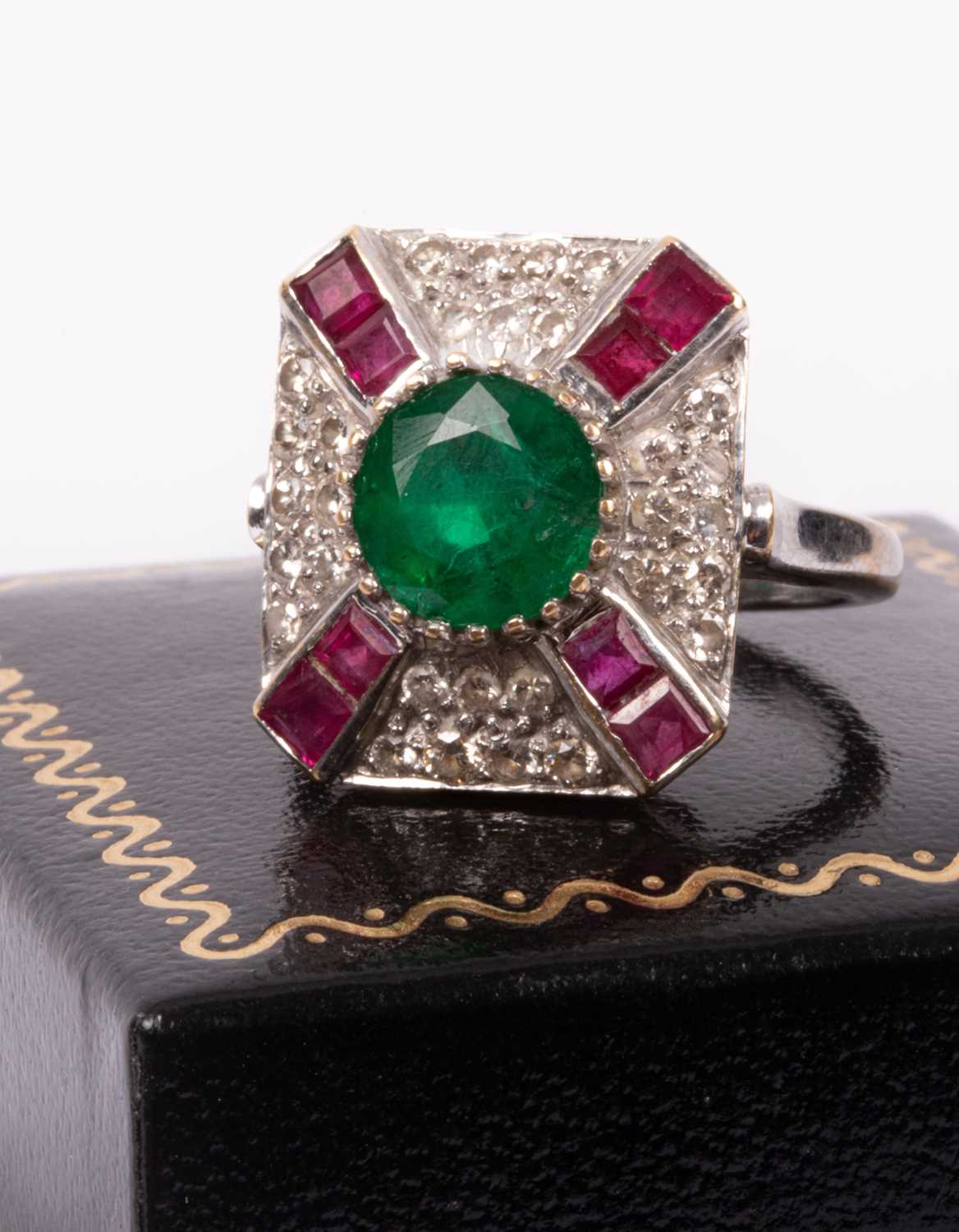 Lot 95 - An 18ct white gold, emerald, ruby and diamond ring