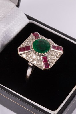 Lot 95 - An 18ct white gold, emerald, ruby and diamond ring