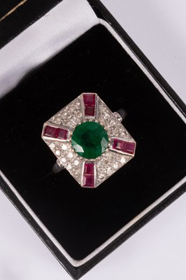 Lot 95 - An 18ct white gold, emerald, ruby and diamond ring