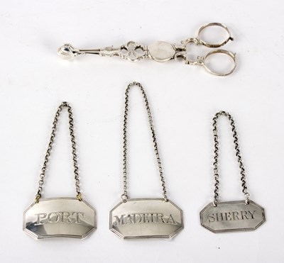 Lot 69 - A pair of silver sugar tongs of scissor form,...