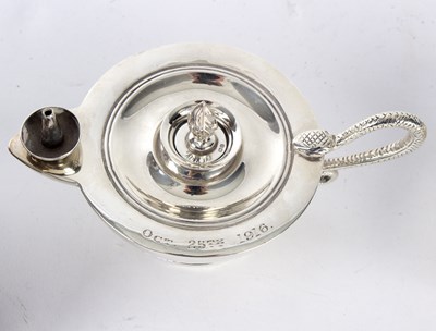Lot 75 - A silver table lighter, marks rubbed, modelled...