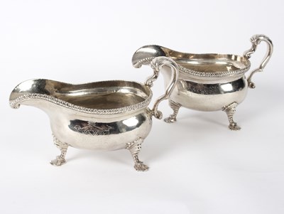 Lot 98 - A pair of George II silver sauce boats, makers...