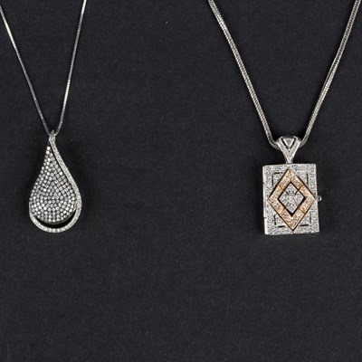 Lot 155 - A diamond teardrop pendant with openwork back...