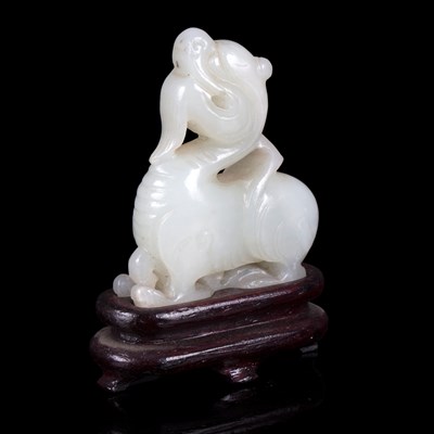 Lot 362 - A pale celadon jade carving, Qing Dynasty...