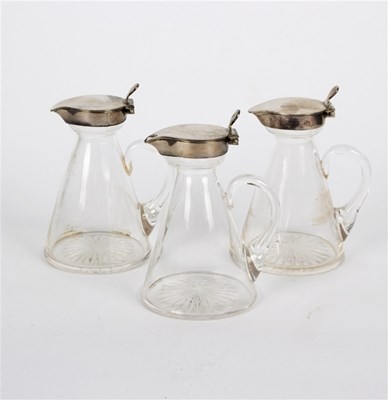 Lot 14 - Three silver mounted whisky toddies, John...