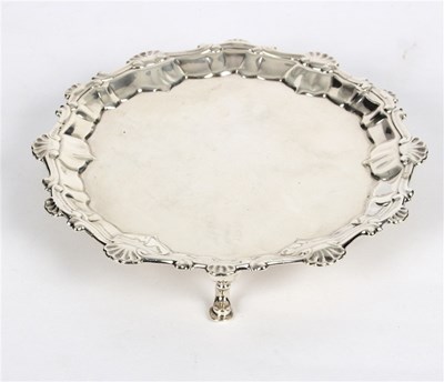 Lot 24 - A George II silver waiter, Ebenezer Coker &...