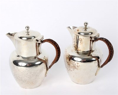 Lot 28 - A pair of silver lidded jugs, John Thomas...