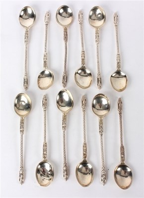 Lot 31 - Twelve silver apostle top teaspoons, John &...