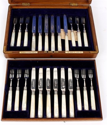 Lot 35 - A set of twelve dessert knives and forks,...