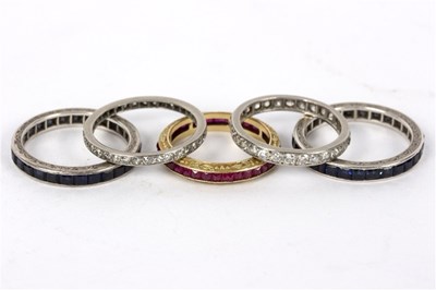 Lot 90 - A diamond eternity ring set in precious white...