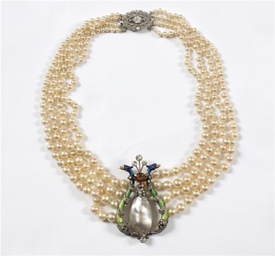 Lot 103 - A four-row faux pearl necklace centred by an...