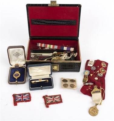Lot 108 - A small jewel case containing enamelled badges...