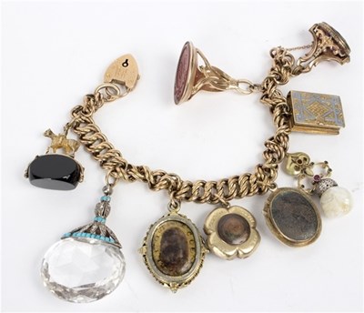 Lot 116 - A 9ct gold fancy link bracelet hung with...