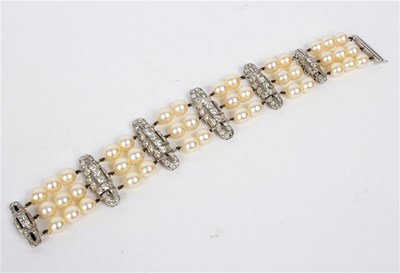 Lot 123 - An Art Deco three-row cultured pearl bracelet...