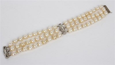 Lot 124 - An Art Deco three-row cultured pearl bracelet...