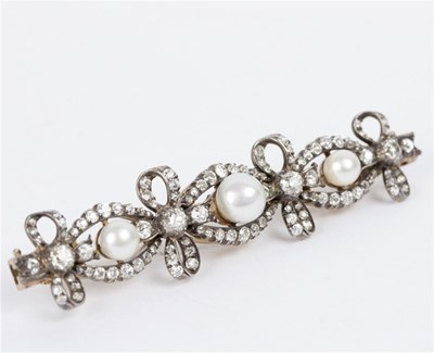 Lot 134 - A pearl and diamond bar brooch adapted from a...