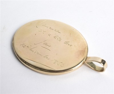 Lot 148 - An oval pendant with initials LX inscribed...
