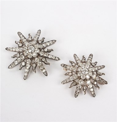 Lot 150 - Two Victorian diamond starburst brooches, the...