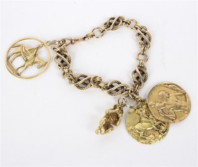 Lot 153 - A 9ct gold fancy link bracelet hung with an...