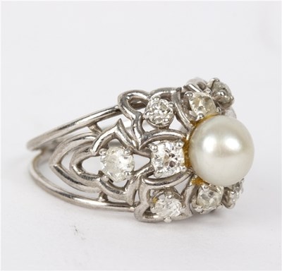 Lot 157 - A diamond and pearl dress ring, the central...