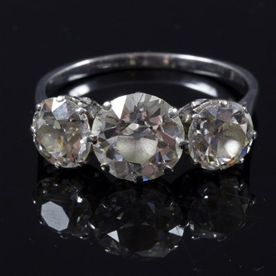 Lot 163 - A diamond three-stone ring, the central stone...