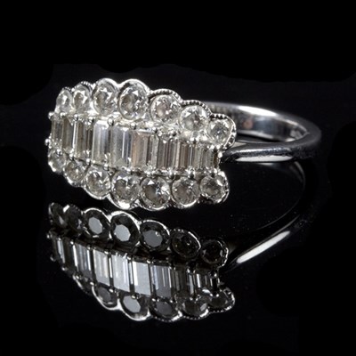 Lot 177 - A diamond dress ring set with nine graduated...