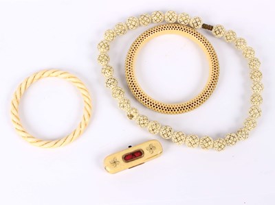 Lot 181 - A 19th Century ivory reticulated bracelet, a...