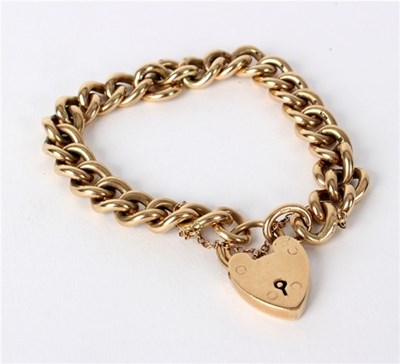 Lot 197 - A 9ct yellow gold curb link bracelet with...