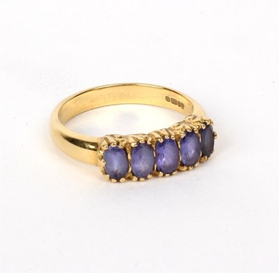 Lot 202 - A five-stone ring set in 18ct yellow gold, the...