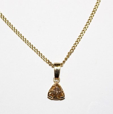 Lot 205 - A diamond pendant, the triangular cut stone...