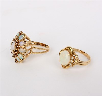 Lot 206 - An opal and diamond ring, the oval opal with...