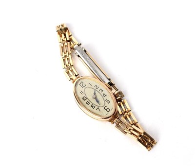 Lot 231 - A lady's 9ct gold cased wristwatch, the oval...