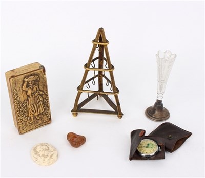 Lot 248 - A gilt metal ring stand, of pyramid form, 15cm...