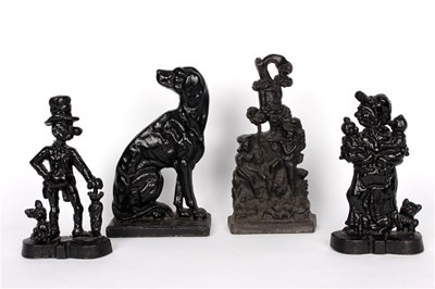 Lot 276 - Four cast iron door stops including hound,...