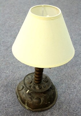 Lot 281 - A Newlyn brass candlestick embossed flowers...