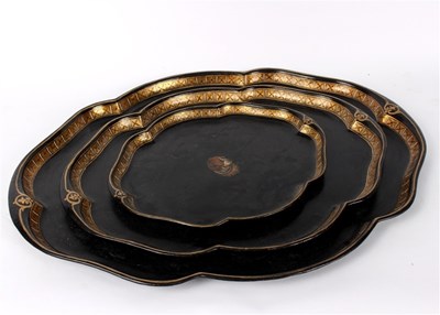 Lot 289 - A set of three graduated ebonised metal trays,...