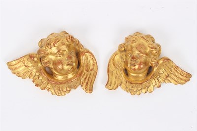 Lot 300 - A pair of gilt plaster cherub mask wall...