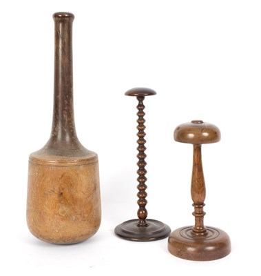 Lot 303 - A turned wood laundry pestle 46cm long and two...
