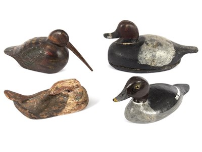 Lot 313 - Four carved and painted wooden duck decoys,...
