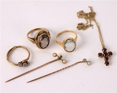 Lot 7 - A diamond three-stone ring set in 9ct gold and...