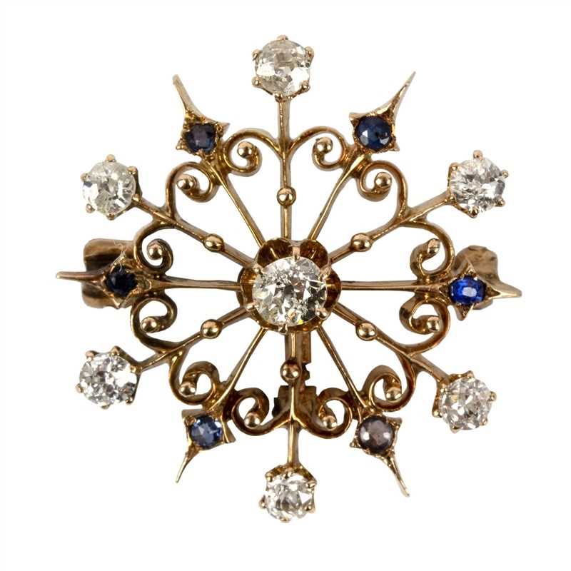 Lot 38 - A sapphire and diamond starburst...