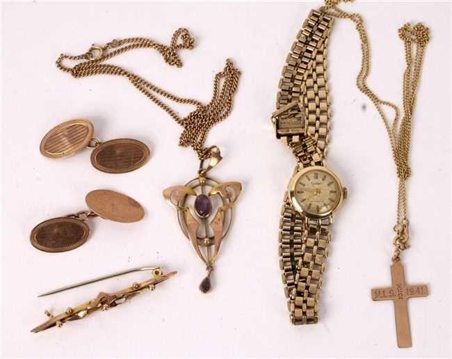Lot 50 - An Art Nouveau pendant of stylised form set in...