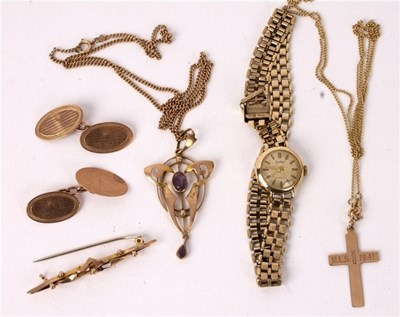 Lot 50 - An Art Nouveau pendant of stylised form set in...