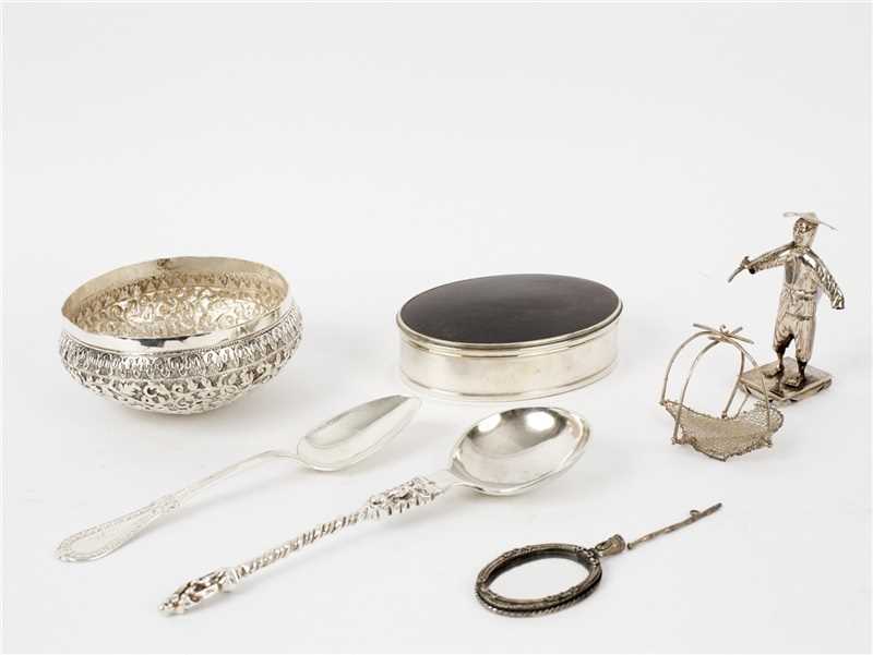 Lot 82 - An oval white metal mounted tortoiseshell box,...