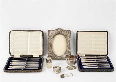 Lot 94 - An embossed silver photograph frame,...