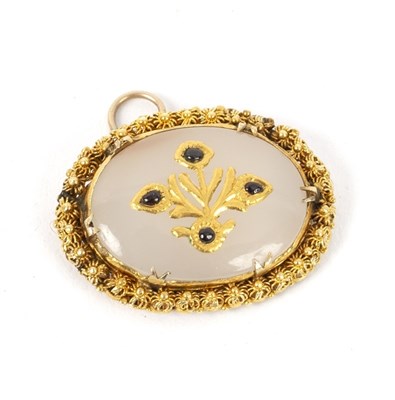 Lot 159 - A Mughal gem set oval pendant, framed in...