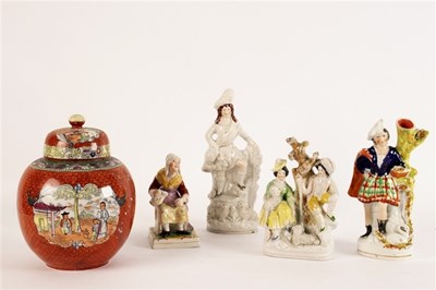 Lot 276 - A Staffordshire figure of a highlander with...